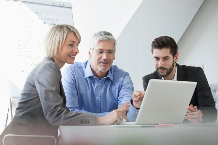 People sharing a laptop